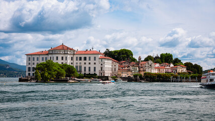 Isola Bella in Italy showcases stunning architecture and serene waters under a blue sky