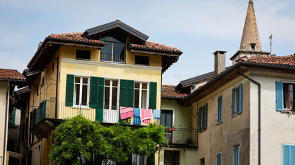 Colorful houses and laundry lines in Isola Bella, Italy, showcasing charming local architecture