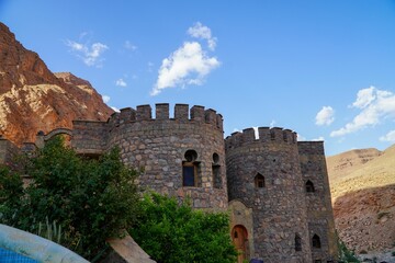 Fototapeta premium Historic stone castle with round towers.