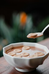 Milk tea with biscuits close-up.