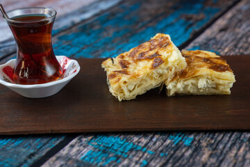 Preparing Traditional Turkish Ramadan Pastry on Wooden Table Photo, Traditional Turkish Cuisine Pastries (Kol böreği, Su Boregi, Sigara Boregi, Rulo Borek) Üsküdar Istanbul, Turkiye (Turkey)