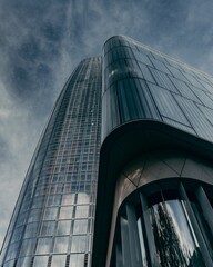 Modern skyscraper with glass facade.
