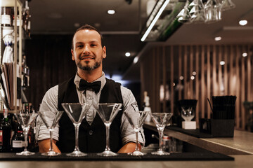Professional bartender in a modern cocktail bar setting