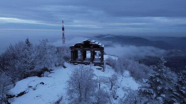 Drone footage of Temple du Donon covered in snow