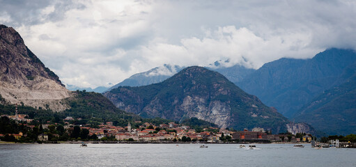 Beautiful views of Baveno on Lake Maggiore framed by mountains under an overcast sky