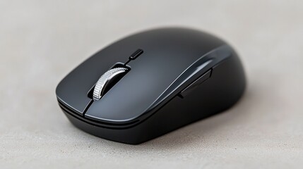 Wireless black computer mouse on light gray surface