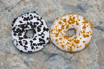 two donuts of different colors on a retro background