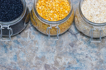 Legumes in glass next to each other on a retro background