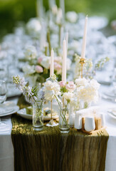 Elegant outdoor dining setup with floral arrangements