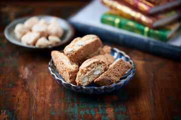 Cantuccini (Italian cookies) on dark wooden background. Close up	