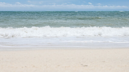 BALI, INDONESIA - JANUARY 22, 2018: Clean sand of Pandava Beach and Indian Ocean waves, Bali.