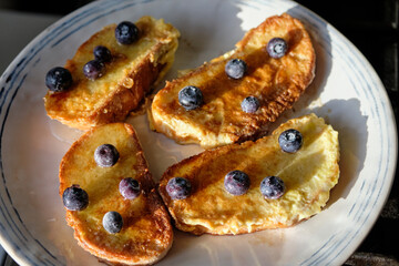 French toast with blueberry. Top view, wooden background
