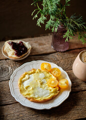 Omelette with  yellow cherry tomatoes.