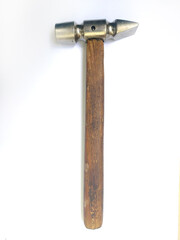 A meticulously detailed closeup showcases a vintage hammer with a worn wooden handle and a metallic head.  The image evokes a sense of craftsmanship and timeless utility.
