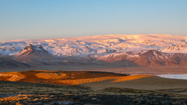 View of sunset over Eyjafjallajokull volcano and Eyjafjoll glacier with beautiful landscape, Dyrholaey, Vik i Myrdal, Iceland.