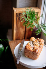 Bananabread decorated with sunflower seeds and banana