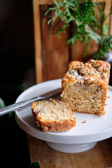 Bananabread decorated with sunflower seeds and banana