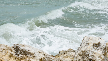 BALI, INDONESIA - JANUARY 22, 2018: Rocks and the Indian Ocean powerful crushing waves near Pandawa...