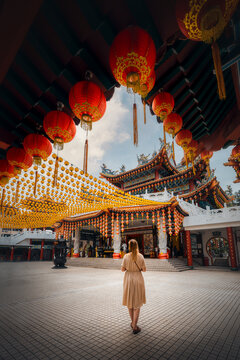 View of the ornate Thean Hou Temple adorned with vibrant red lanterns, Kuala Lumpur, Malaysia.
