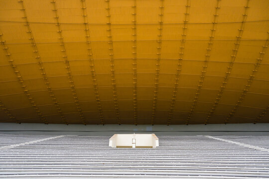 View of modern architectural stadium with minimalist design and empty seating, Snipiskes, Lithuania.