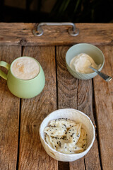 dumplings with potatoes decorated with black sesame seeds and sour cream.
