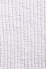 Patent brioche stitch white knitted pattern background texture. Top view of knitting clothes