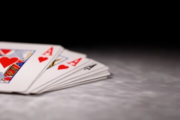 Playing cards arranged with hearts, showcasing vibrant colors an