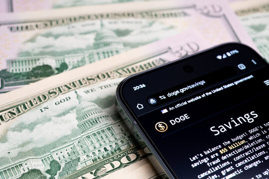 DOGE US Department of Government Efficiency logo seen on the smartphone screen. Concept. Stafford, United Kingdom, February 25, 2025