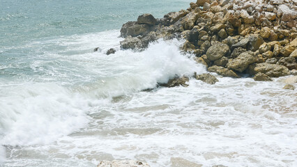 BALI, INDONESIA - JANUARY 22, 2018: Stunning ocean waves hit rocks near Pandawa Beach, Bali.