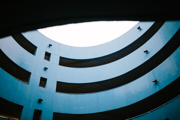 Blue parking lot structure with a modern curved design