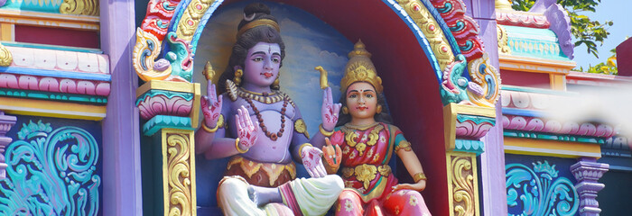 vibrant statue of lord shiva and goddess parwati