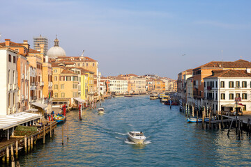 view from Rialto bridge on Grand Canal of Venice, boats and gondola