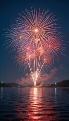 Spectacular Fireworks Display Over Lake at Night with Vibrant Reflections