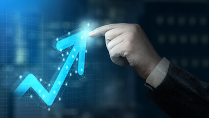 Businessman pointing upward arrow of economic chart and global trend. Concept of business growth,...