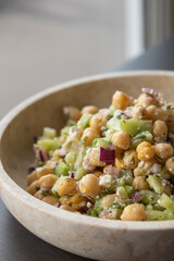 delicious healthy salad with chickpeas, cucumber, and feta cheese close-up