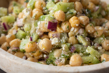 delicious healthy salad with chickpeas, cucumber, and feta cheese close-up