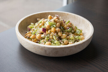 delicious healthy salad with chickpeas, cucumber, and feta cheese close-up