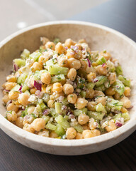 delicious healthy salad with chickpeas, cucumber, and feta cheese close-up