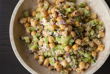 delicious healthy salad with chickpeas, cucumber, and feta cheese close-up