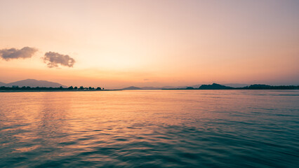 Horizon sea sky background, Sunset sky clouds over sea in the morning with Orange, Yellow sunrise golden hour in summer landscape, dusk sky seascape backgrounds