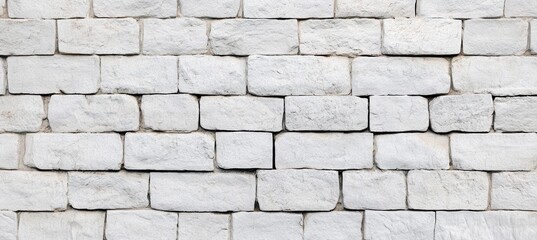 Obraz premium Textured White Brick Wall with Soft Lighting, Perfect for Backgrounds and Design Projects