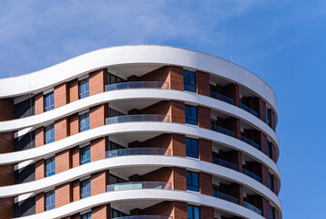 Curved Modern Building with a Mix of Glass and Wood
