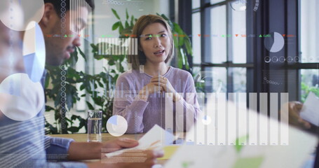 Image of financial data processing over diverse colleagues discussing work in office