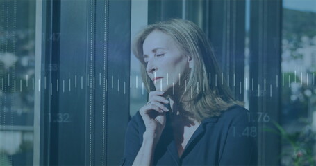 Image of financial data processing over caucasian businesswoman in office