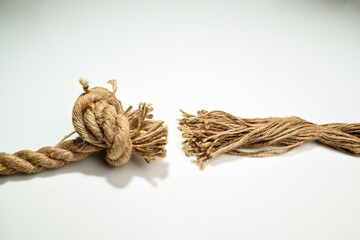 Closeup view of ropes string with a knot isolated over a white background