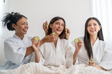Diverse group of beauty women enjoy skincare routine, applying cucumber eye masks for hydration and wrinkle free skin, beauty self care spa, cosmetic, glowing and refreshing facial treatment at home
