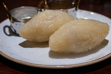 Large potato dumplings called Cepelinai - one of the dishes of traditional lithuanian cuisine. Also known in Poland and called Cepeliny or Kartacze