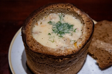 Mushroom soup served in bread, one of the dishes of traditional lithuanian cuisine