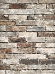 Textured Wall of Rustic Brick with Variation of Earthy Tones and Patterns Captured in Detail