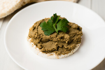 Healthy food, crispy rice cakes and beef liver pate on a light background